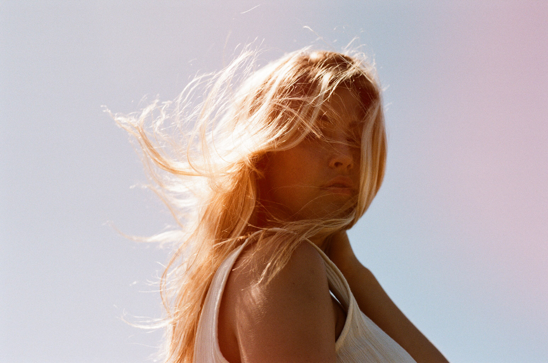 woman looking back while running in the wind