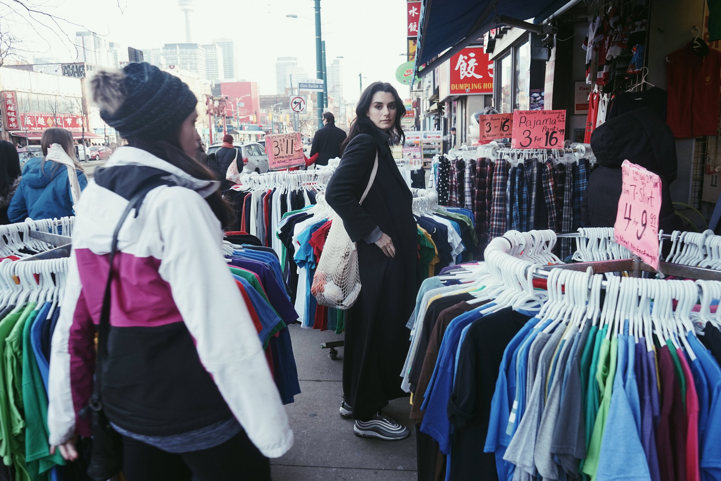 Woman Standing at Clothes Market